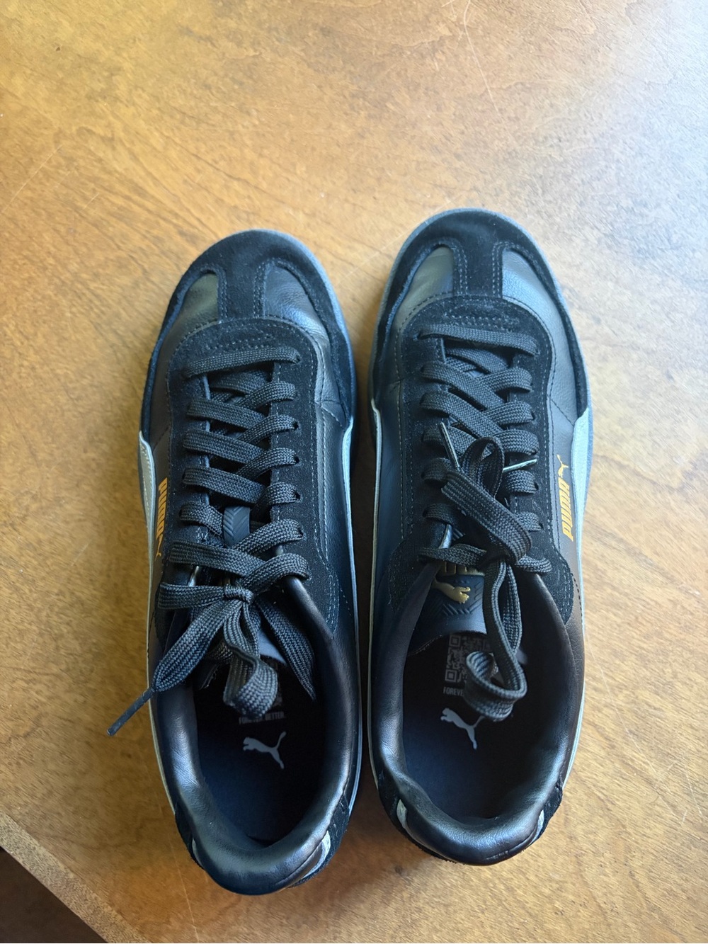 Puma Men's Black Sneakers with Gold Logo Accent